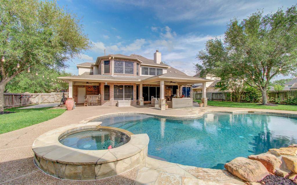 View of back patio and pool