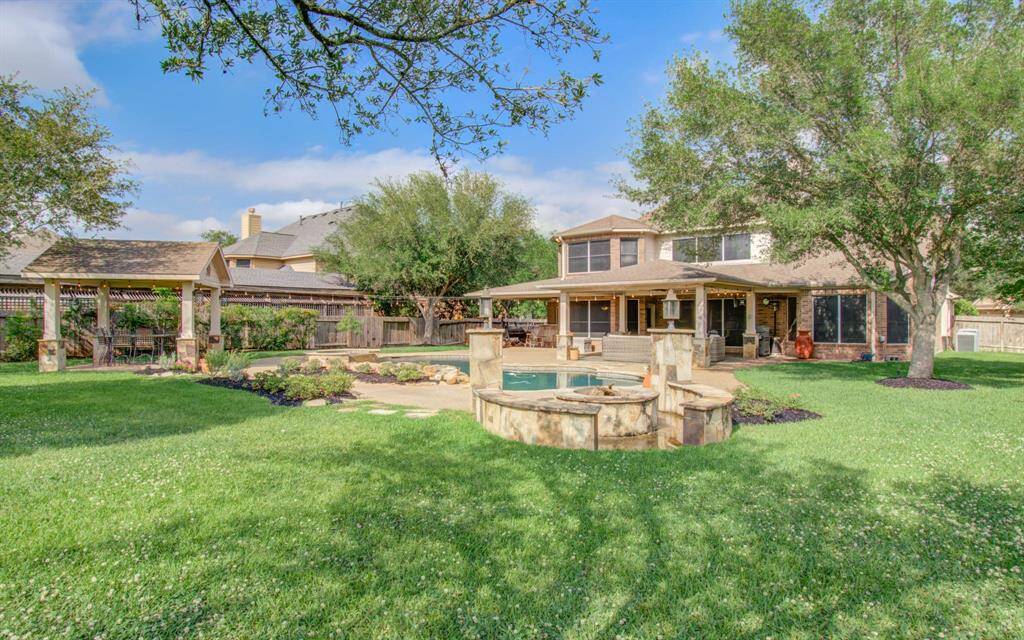 View of back patio and pool