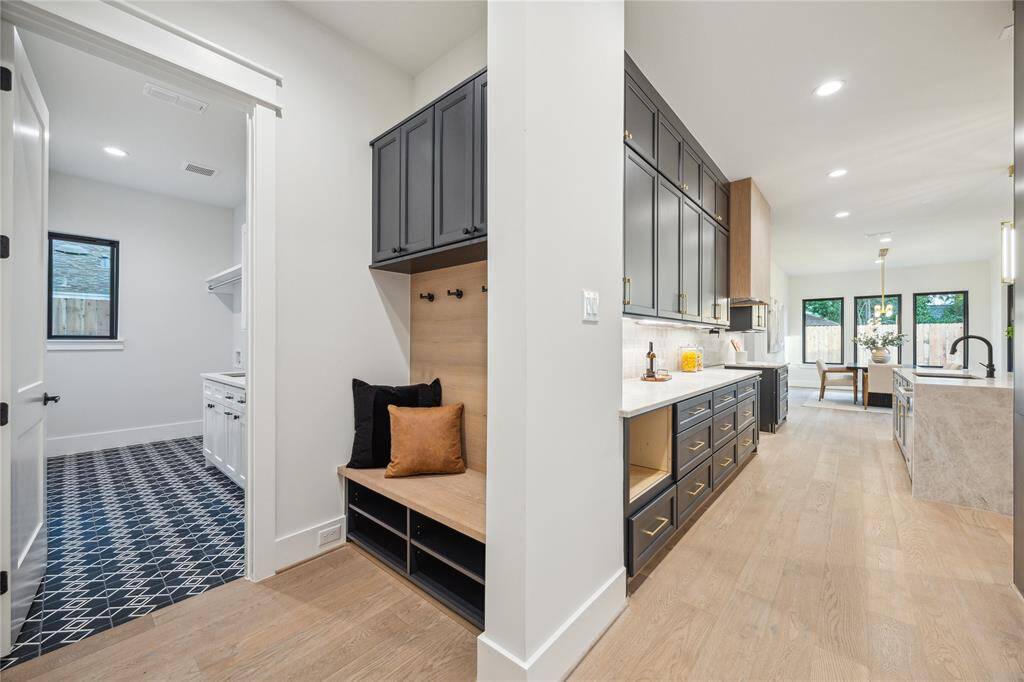 The mudroom is located just outside the garage with direct access to the laundry room, pantry and kitchen.