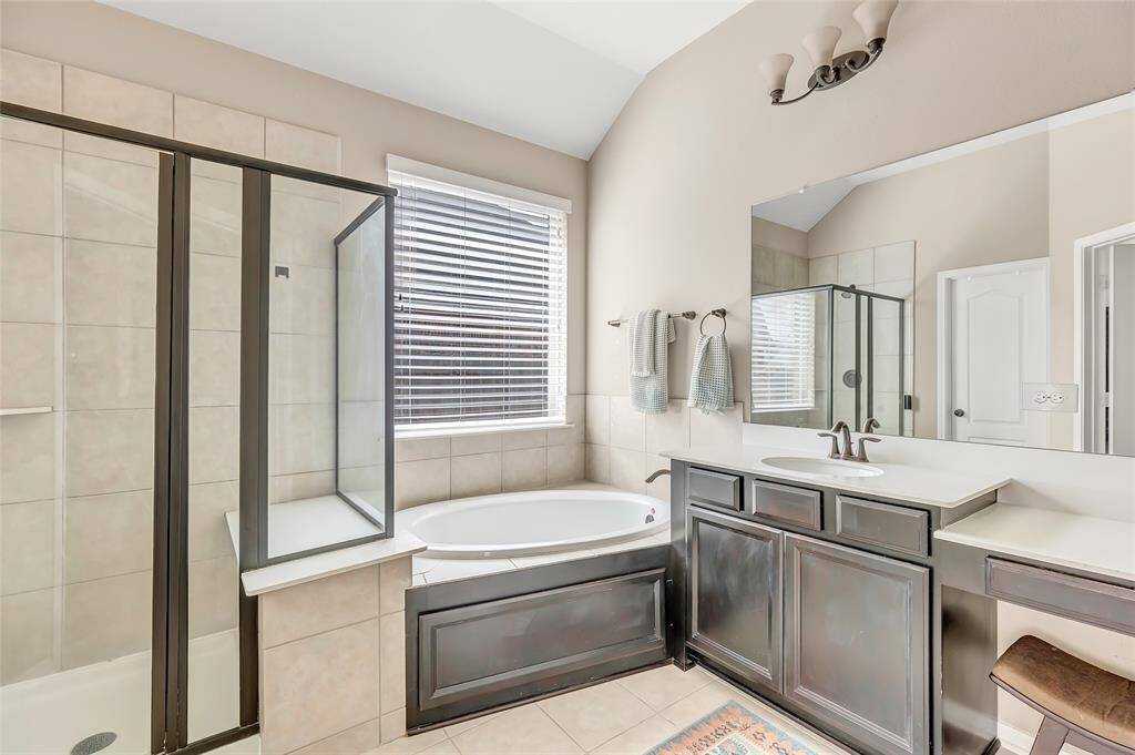 Master bathroom complete with double sinks, large tub and shower.