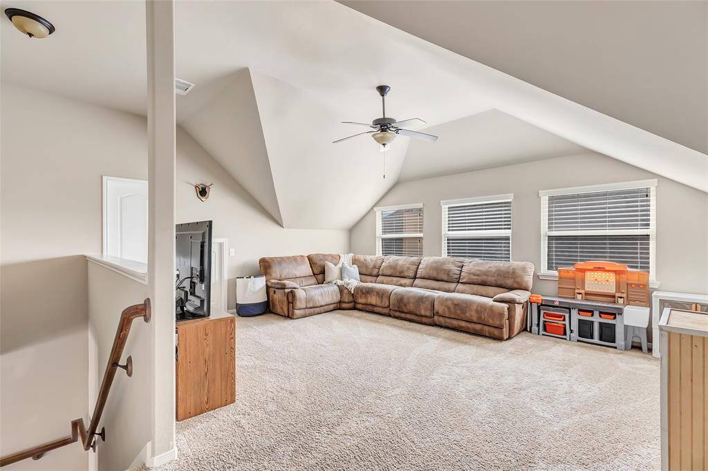 Large game room or flex room with half bathroom upstairs.