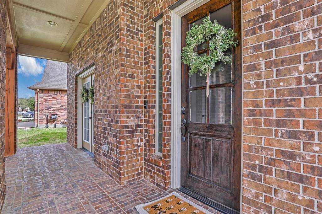 Huge front porch perfect for rocking chair seating or patio furniture!