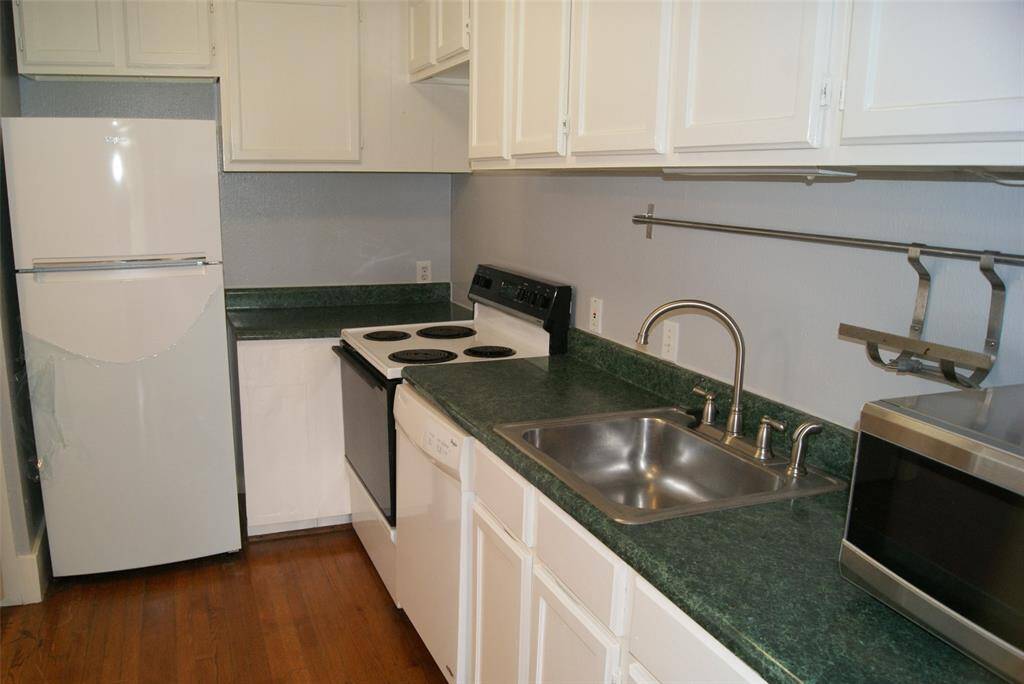 Big, eat-in kitchen with hardwood floors.  Refrigerator, microwave, stacked washer and dryer included in lease.