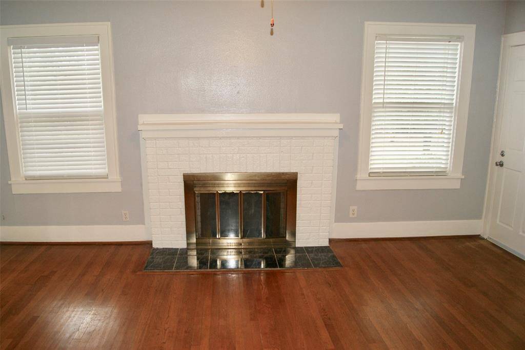 Large 18 ' x13' Living Room with gleaming hardwood floors and fireplace.