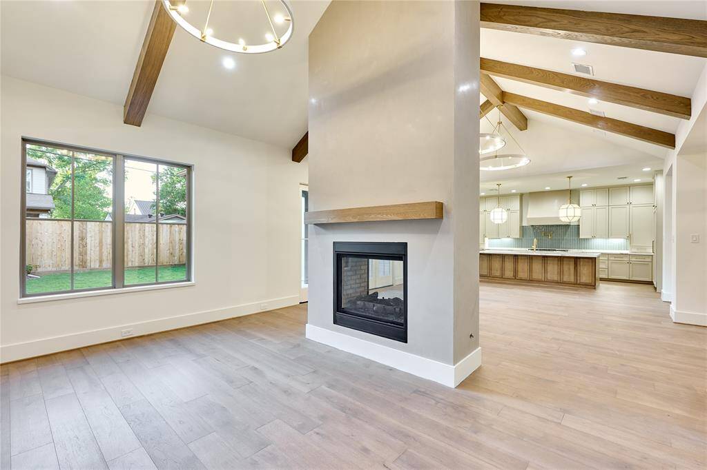 Den-style living area featuring a double-sided fireplace.