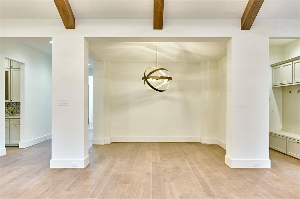 Elegant formal dining room with a striking French-pointed ceiling.
