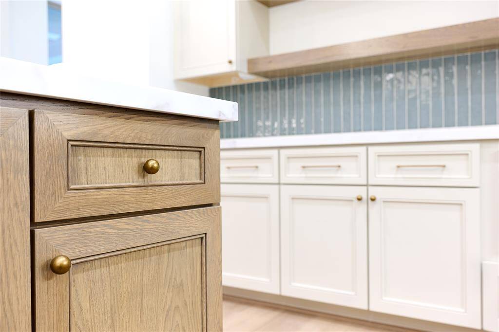 Beautiful wood-tone cabinetry by Kent Moore.