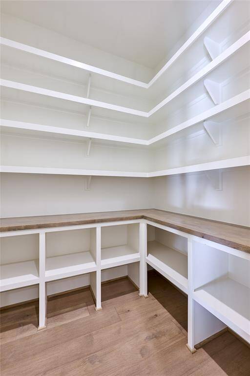 Generously sized walk-in pantry, providing ample storage and easy organization for all your kitchen essentials.