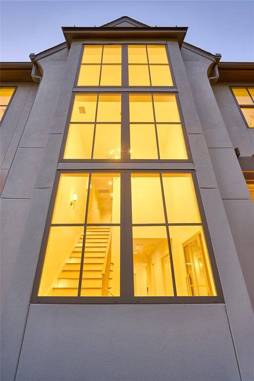 This home offers expansive windows that allow ample natural light.