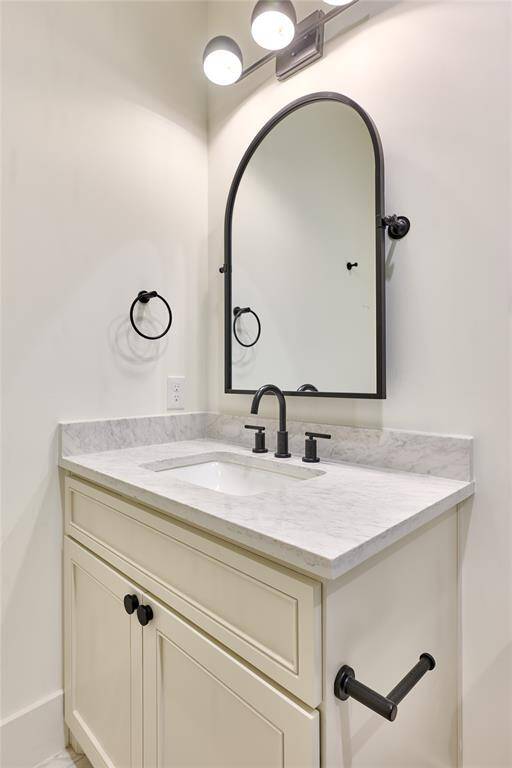 The full secondary bathroom on the second floor offers a clean design with quality finishes.