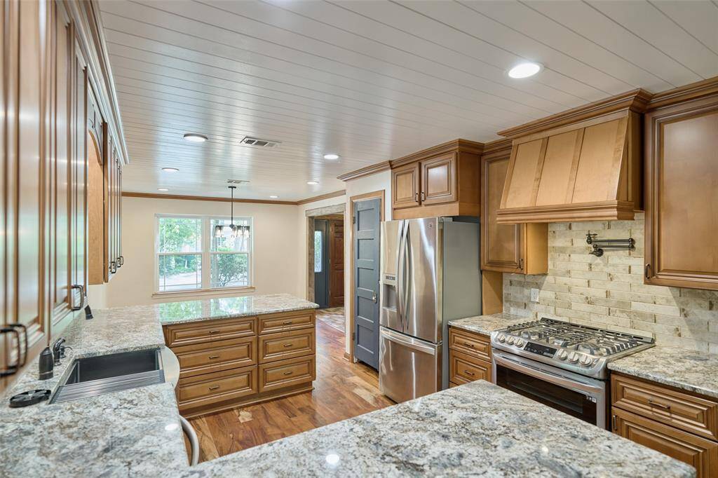Stainless appliances and an amazing double oven with vented stove top!