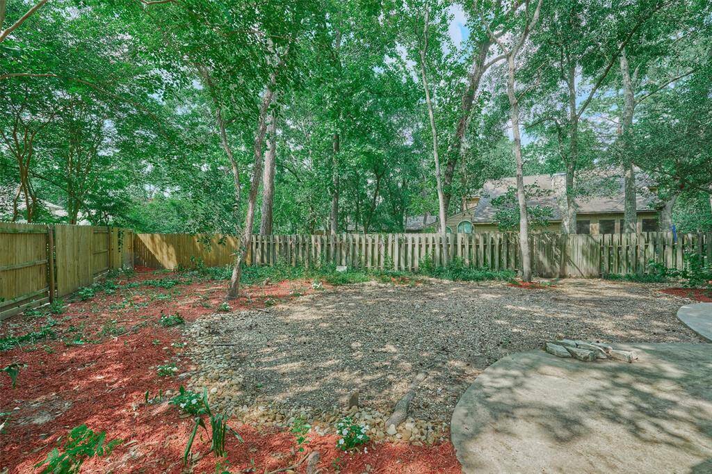 Amazing and large backyard for your enjoyment with several concrete spaces.