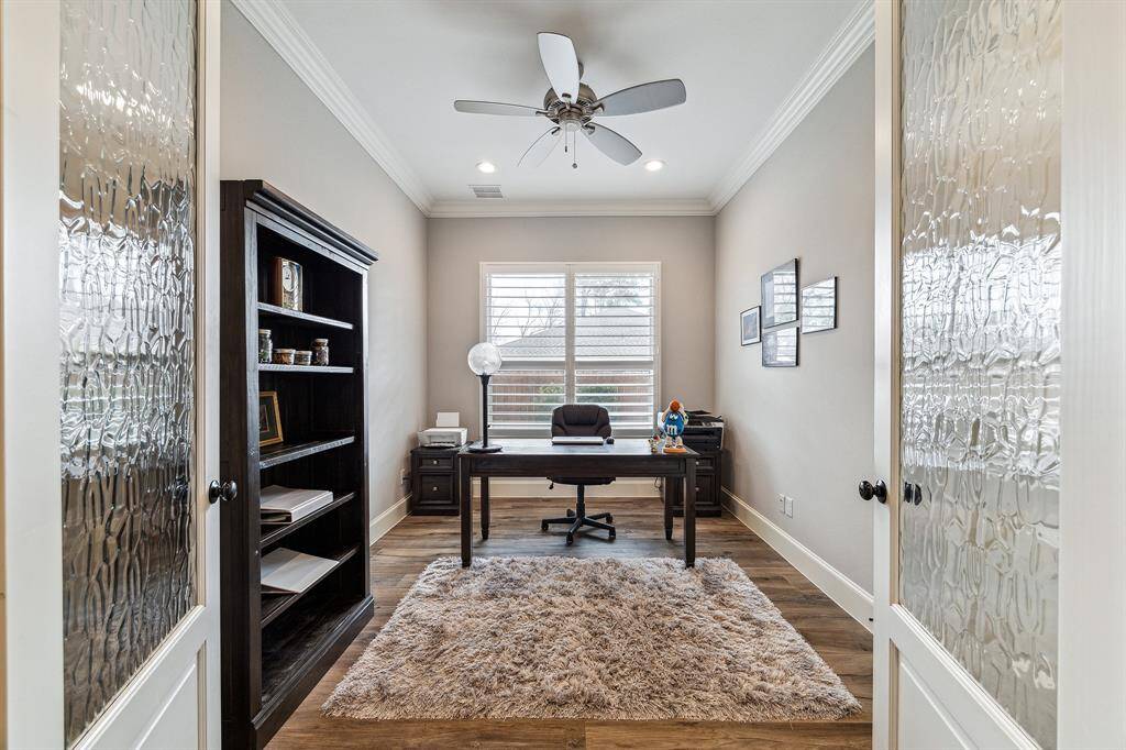 The office/study room on the first floor features double French doors and includes a closet, making it easily convertible into a fourth bedroom.