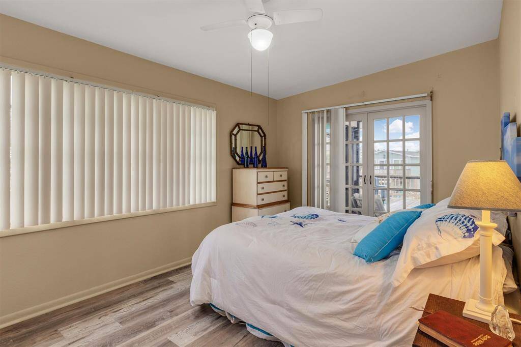 Large window and french doors to capture the light and makes a wonderful breeze.
