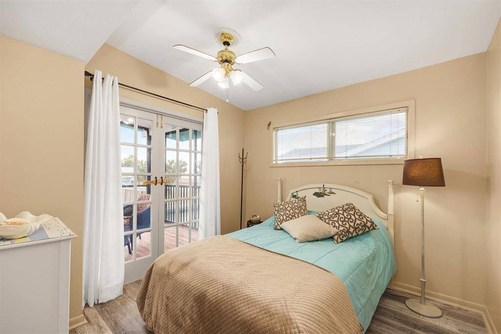 Third bedroom includes french doors for breezes and a wonderful view of canal.