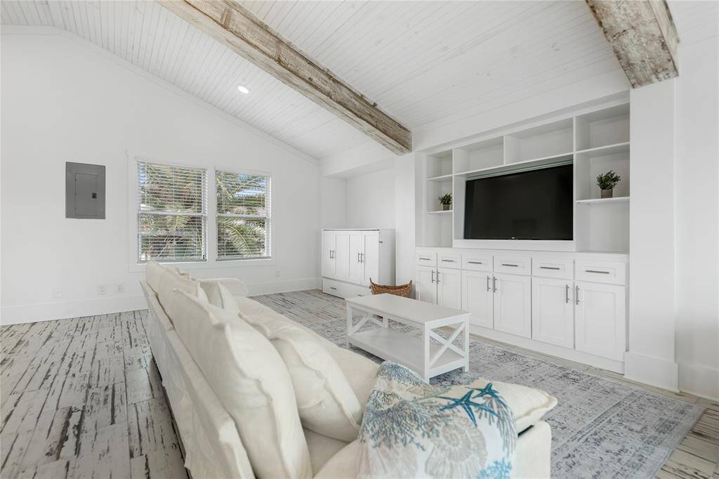 Clean and simple with a touch of island style—ideal for rinsing off after beach or boat adventures. Ground level covered porch and an enclosed outdoor shower.