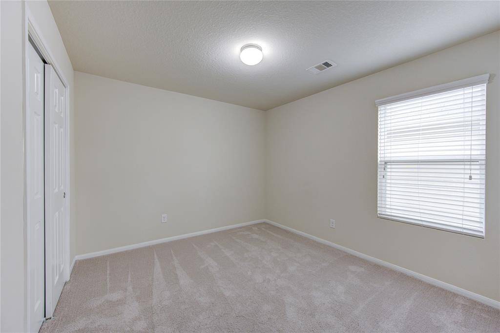 Another view of the primary bedroom. The entire upstairs has this brand new carpeting!