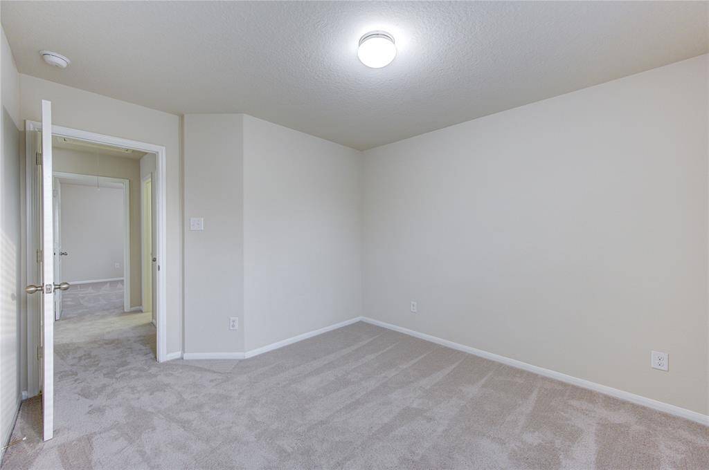 The primary bath is a dream with a large soaking tub and glass stall shower!