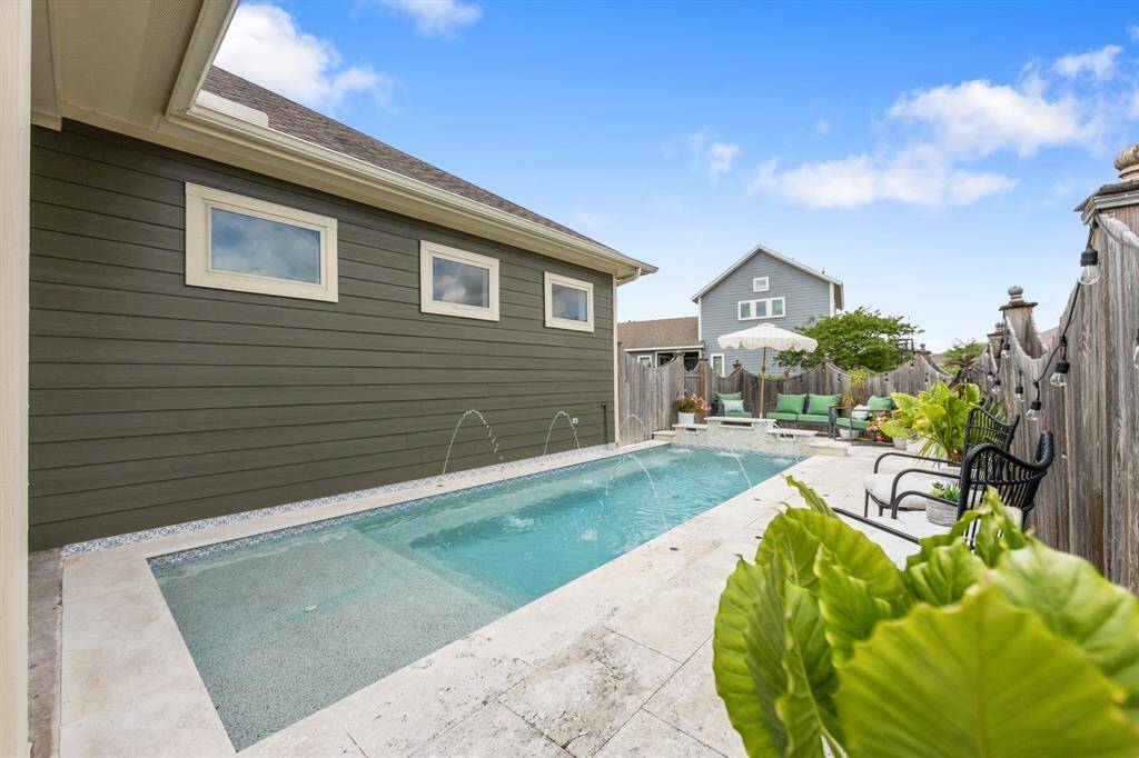 Prepare for year round holidays in this beautiful property featuring a heated, gunite, in-ground pool, providing a cozy and inviting backyard oasis!