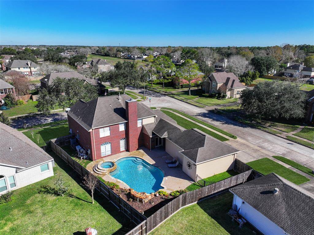 Welcome to 1712 Orlando Street in west Friendswood's Boca Raton community! This traditional red brick two-story home with manicured landscaping, ample parking, and a sparkling pool is situated on a desirable corner lot near the community park and pool.