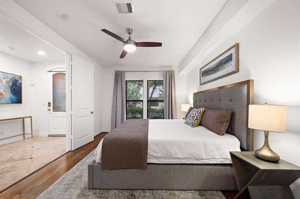 Positioned just off the entry, this bedroom is ideal for guests or a home office setup, complete with easy access to a full ensuite bath and a welcoming first-floor layout.