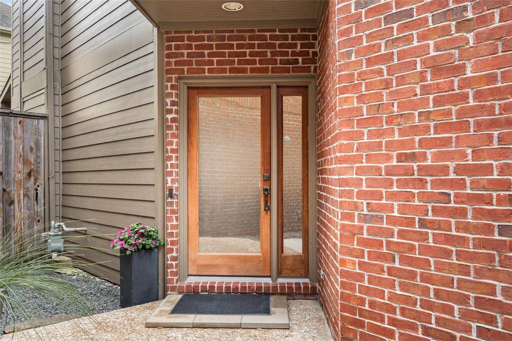 Elegant French door upgraded with frosted glass offers privacy and abundant natural light.