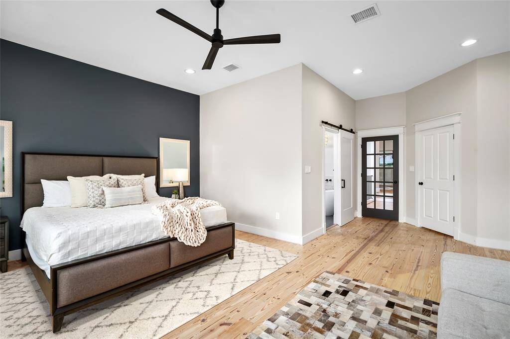 [Primary Suite] Boldly colored accent wall adds a striking touch to this great space