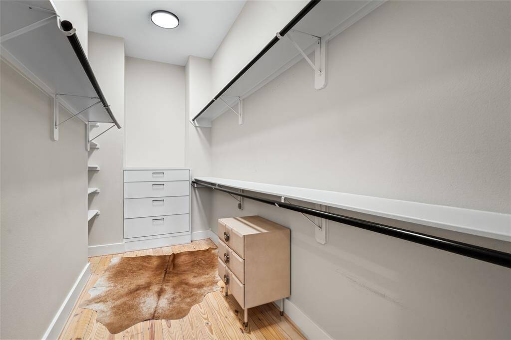 [Primary Closet] Commodious walk-in closet, generously proportioned for any size wardrobe