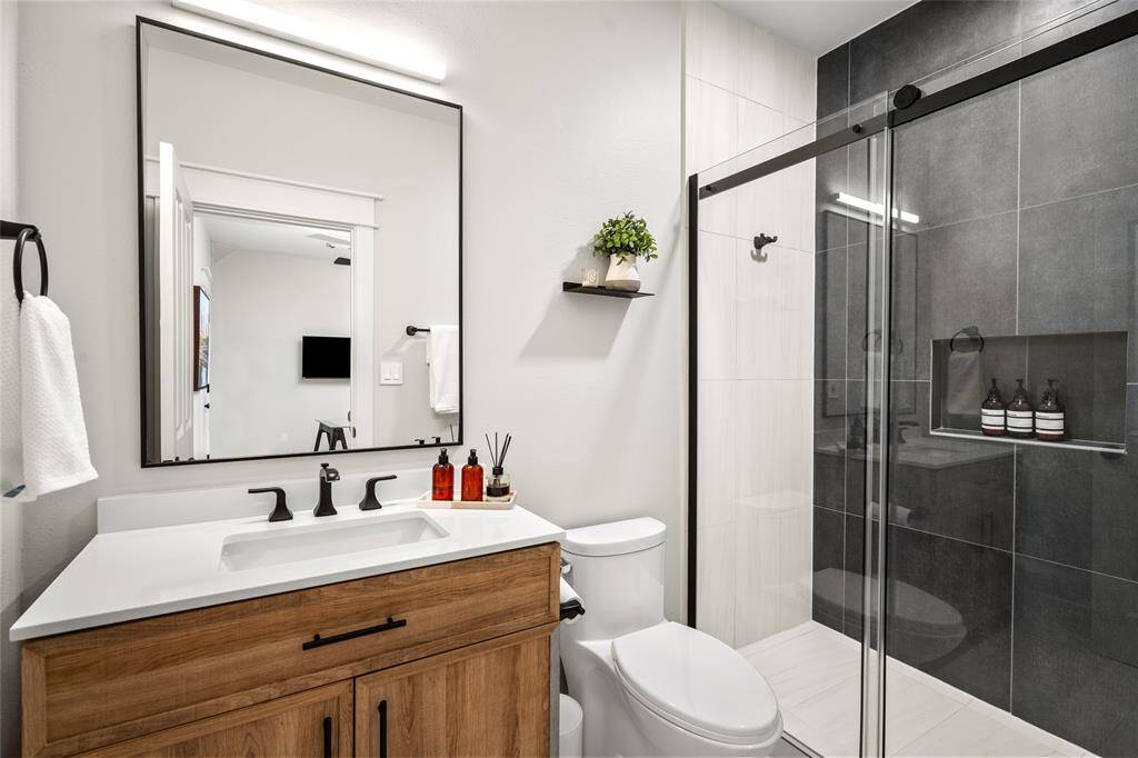 [Secondary Bath] Chic secondary bathroom conveniently located near the secondary bedroom and loft office.