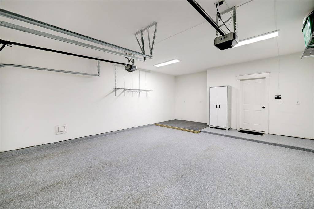 [Garage] Large garage recently epoxied, offers additional storage space