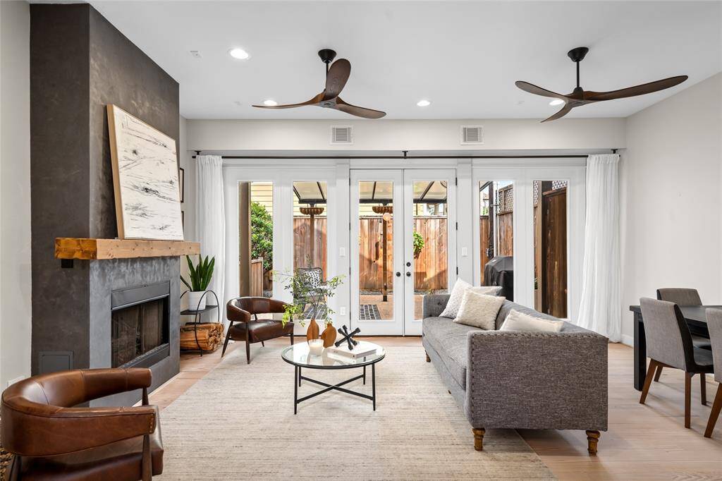 Spacious living area with seamless access to a charming backyard.