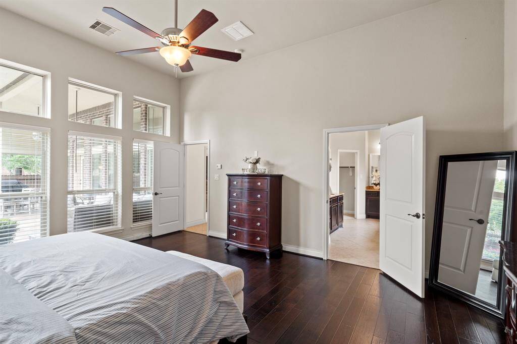 A full wall of windows fills the room with natural light and offers tranquil views of the covered patio and backyard oasis, creating the perfect start and end to your day.