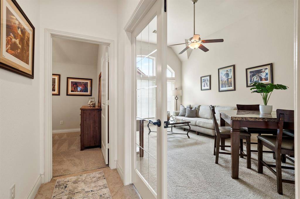 Step into this versatile wing of the home, where a private hallway leads to a charming bonus/game room with French doors, and a spacious guest suite with an en-suite bath.