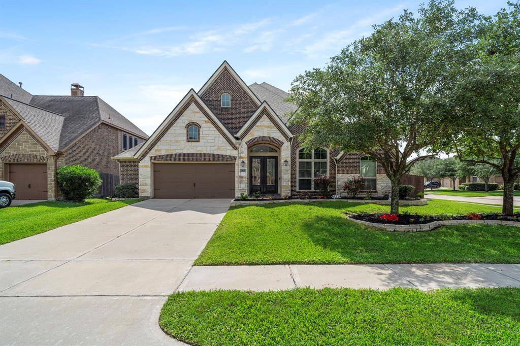 Perfectly positioned on a premium corner lot, this beautifully maintained home offers added privacy, mature trees, and vibrant flower beds for standout curb appeal.
