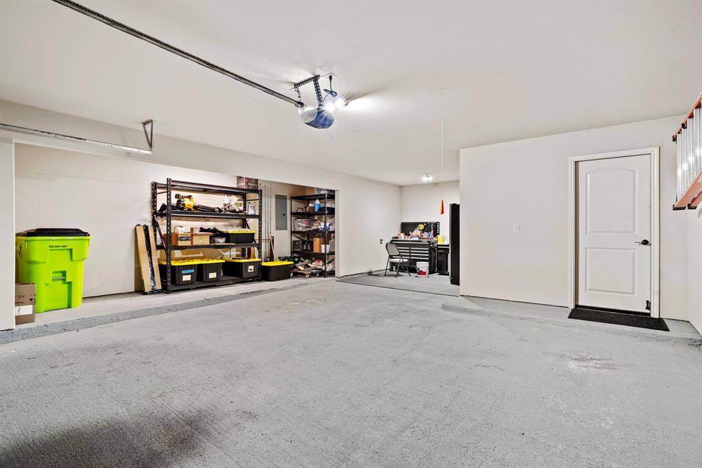 This spacious garage includes room for three vehicles, and an extended storage area for endless space for ultimate organization.