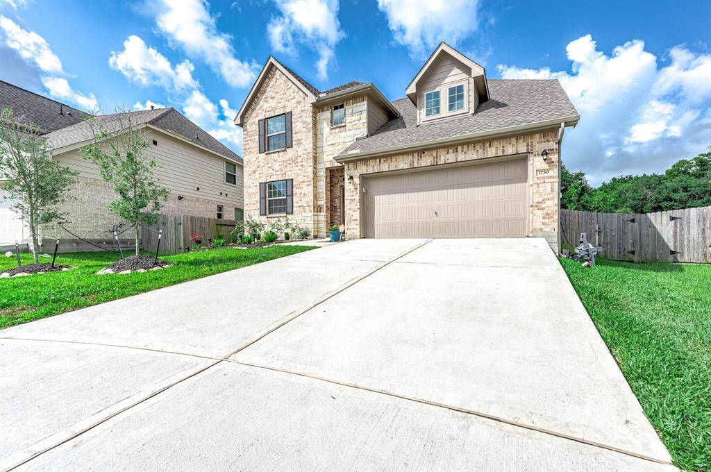 Double wide driveway and two car garage