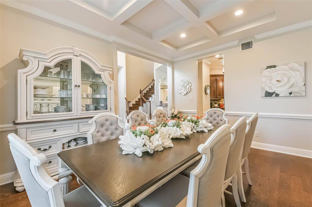Spacious Dining room with custom inset ceiling.