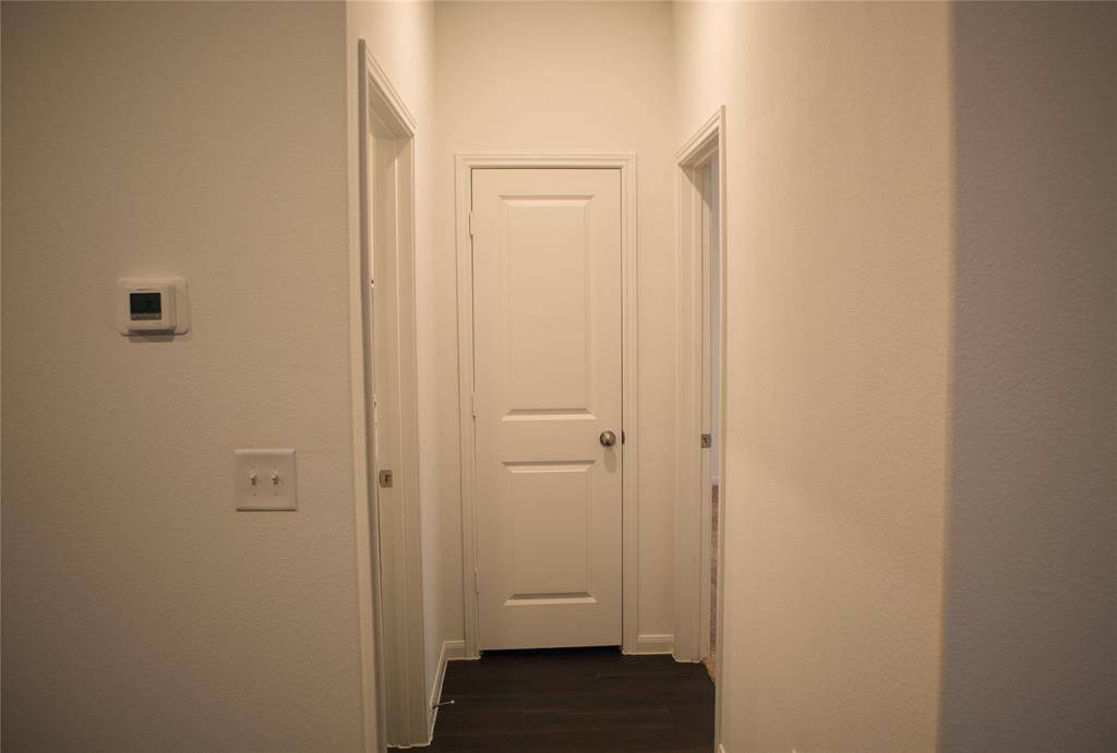 Just outside the Primary Suite you will notice a hall closet and laundry room.