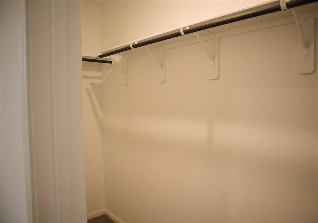 Long walk in closet in the primary suite