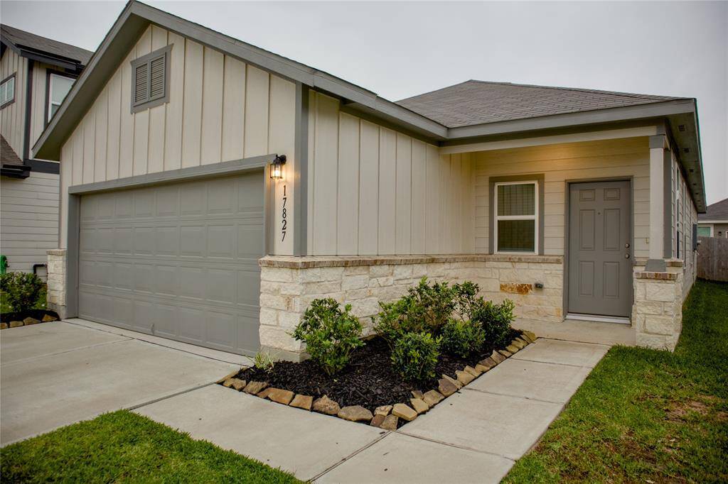 The home is lovely as you walk up you will notice the pretty landscaping and cozy porch.