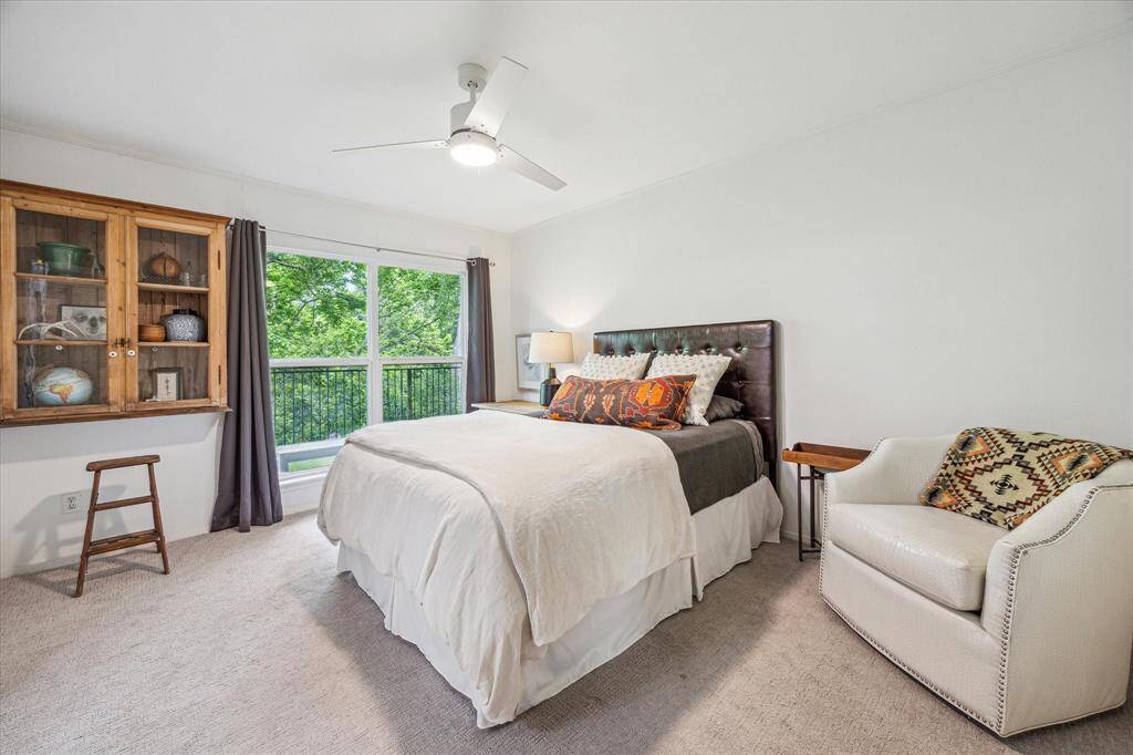 The light-filled primary bedroom features an en-suite bath and walk-in closet. A wonderful view outside your window!