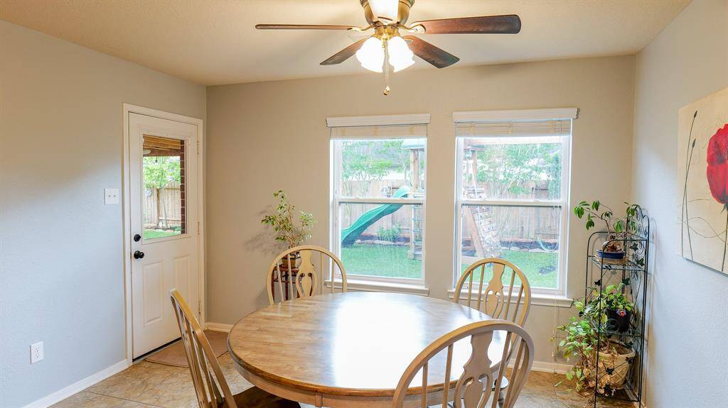 The door to the patio/backyard is perfectly located off the kitchen making ease access for outdoor grilling or  alfresco dining.