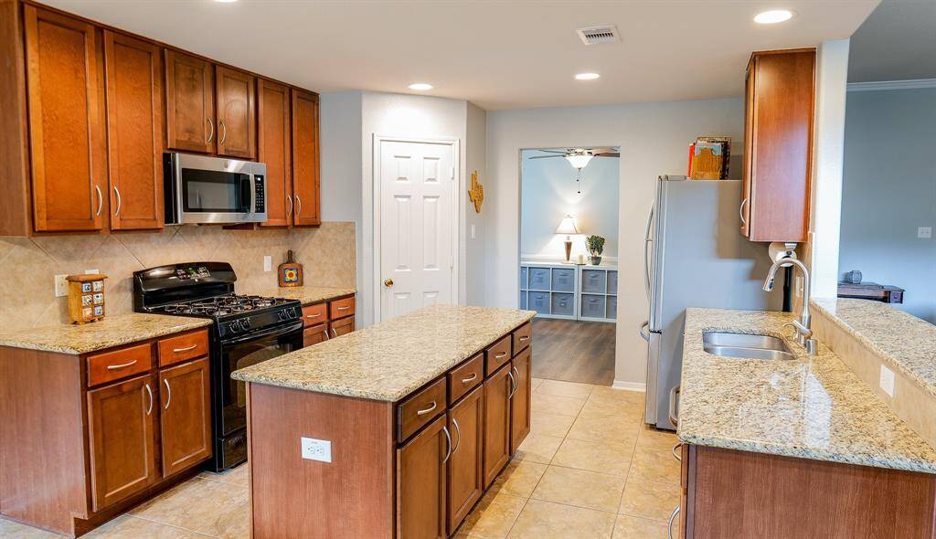 The kitchen also has a walk-in pantry, plenty of cabinets and access to the dining room.