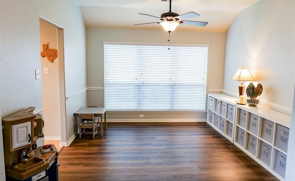 The spacious dining room is currently being used as a play room.