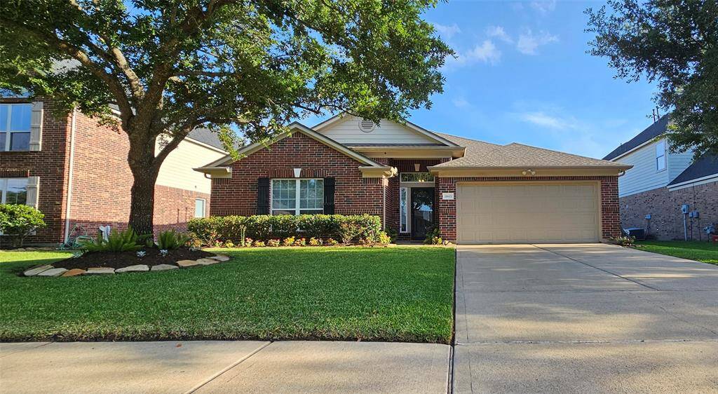 There is a gorgeous shade tree in the front, a double wide drive, and sidewalks throughout neighborhood for the kiddos and pets.