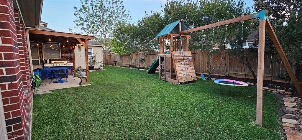 The spacious backyard is as pristine as the front with plenty of room to run and play.