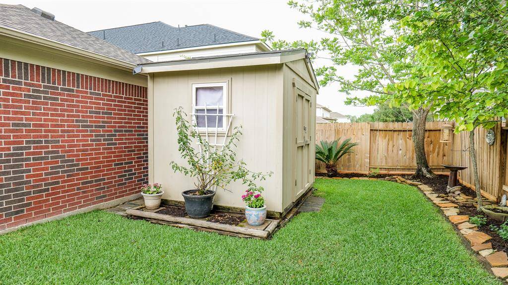 The shed stays with the house for extra storage space.