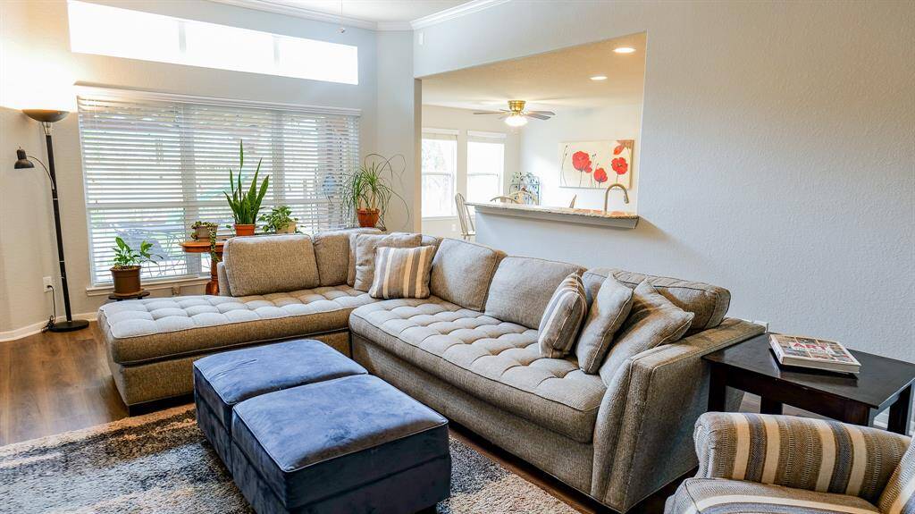 The den is open to the kitchen and has a fabulous wall of floor to ceiling windows.