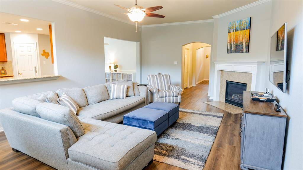 You can relax in the den that has a gas-log fireplace and is open to the kitchen and the dining room.