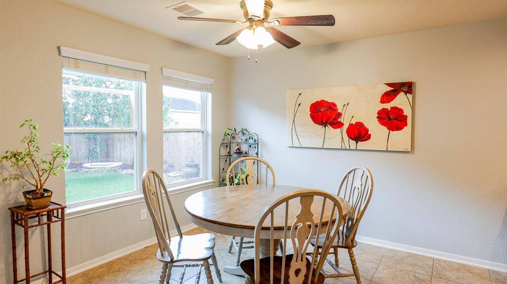 The Breakfast area is light and bright with view of the landscaped backyard.